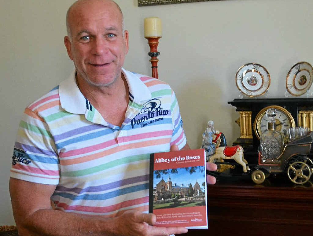 HISTORIC PIECE: Owner Mark Cains with his book Abbey of the Roses – A Historic Record 1891 to 2013. HISTORIC PIECE: Owner Mark Cains with his book Abbey of the Roses – A Historic Record 1891 to 2013.